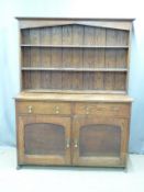 A late 19th/20thC oak dresser, W140 D48 H185cm