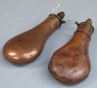 Two Sykes copper and brass powder flasks, largest 21cm long.