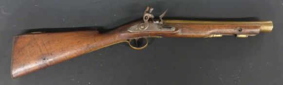 Flintlock hammer action blunderbuss with engraved lock and hammer, brass trigger guard, butt plate