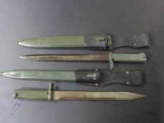 Two German Erstaz all steel bayonets, one with acceptance stamp, both with 31cm blades, scabbards