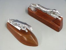 Outstretched greyhound car mascot on wooden display base, length 17cm together with a small Jaguar