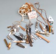 A collection of whistles to include ACME Referee, GPO example, horn whistle, baby's rattle with
