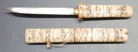 Japanese Tanto dagger with carved bone handle and scabbard depicting figures and 15.5cm blade,