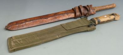Two Martindale machetes including a vintage leather handled example, longest 50cm