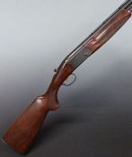 Beretta 686 Onyx 12 bore over and under ejector shotgun with named lock, chequered semi-pistol