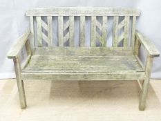A garden bench and folding table