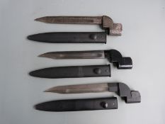 Three British No9 Mk1 bayonets with 20cm fullered bowie blades and scabbards