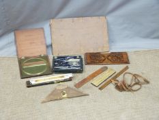 A quantity of draughtsman's equipment including curves, large 19thC brass protractor, 19thC fretwork