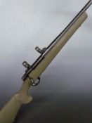 Howa Model 1500 6.5x55 bolt-action rifle with semi-pistol grip, sling suspension and scope mounts