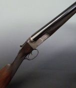 BSA 12 bore side by side shotgun with  monogrammed lock, chequered grip and forend, vacant cartouche