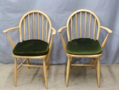 A pair of retro light elm Ercol armchairs