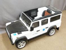 Child's electric Land Rover Defender ride on toy car with parental remote control, LED lights, power