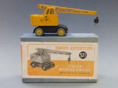 Dinky Supertoys diecast model Coles Mobile Crane with black base and yellow superstructure and hubs,