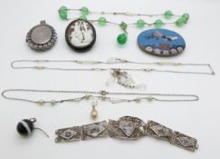 Victorian jet brooch set with a cameo, silver locket, Japanese cloisonné buckle etc