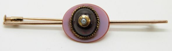 Victorian yellow metal brooch set with agate, foiled garnet and a pearl, 7.3cm
