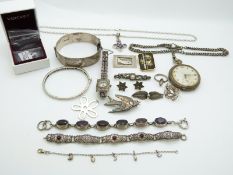 Two silver bangles, Danish silver brooch, two silver rings, a carved abalone brooch depicting a
