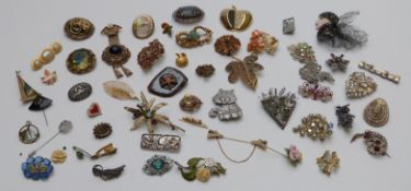 A collection of brooches including Sphinx, paste set etc
