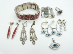 A pair of Butler and Wilson earrings in the form of eyes, a pair of marcasite earrings, silver