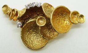 A yellow metal brooch set with four diamonds in a bespoke design, 12g, 4.5 x 2.5cm