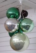 Six glass witch's balls or oversized baubles, diameter of largest approximately 25cm, and a small