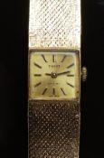 Tissot Stylist 9ct gold ladies wristwatch with black hands, two-tone markers and champagne dial,