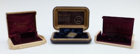 Three Bulova wristwatch boxes comprising one Art Deco example with gold and cream exterior and '