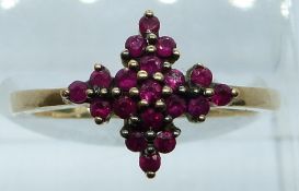 A 9ct gold ring set with rubies in a cluster, 2.6g, size M/N