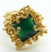 An 18ct gold ring set with a square cut chrysophase cabochon, 10.2g, size O