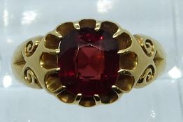 Victorian 18ct gold ring set with a cushion cut almandine-pyrope garnet of approximately 2.35ct with