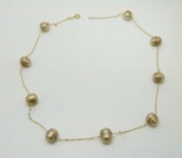 A 14ct gold necklace set with pearls