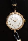 Tudor 9ct gold ladies wristwatch with inset subsidiary seconds dial, gold hands and Arabic numerals,