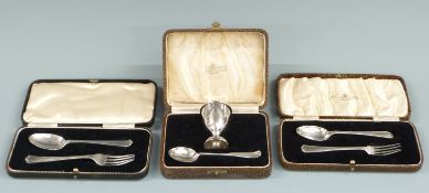 Two cased hallmarked silver fork and spoon sets and a cased hallmarked silver egg cup and spoon set,
