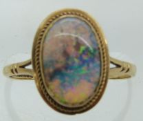 A 9ct gold ring set with an oval opal cabochon, 2g, size O