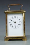 A 20thC brass carriage clock in corniche style case, with unnamed keyless movement and enamelled