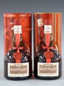 Two bottles of Grand Marnier Cordon Rouge cognac liqueur, 700ml, 40% vol, in original metal
