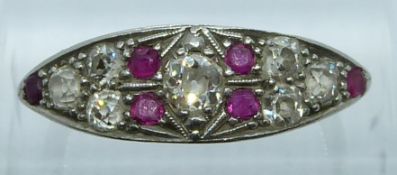 Art Deco 18ct gold ring set with seven old cut diamonds, the central diamond of approximately 0.