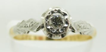 An 18ct gold ring set with a diamond in a platinum setting, 2.2g, size M