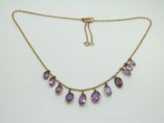 Victorian 9ct gold necklace set with graduated oval amethysts