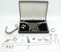 A silver necklace made up of spheres in a lattice pattern, silver necklaces, silver bangle etc