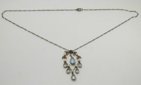 Victorian gold pendant set with six pear cut aquamarine drops, a single round cut aquamarine,