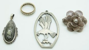 A yellow/ white metal eternity ring, filigree brooch and two silver pendants