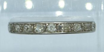 A white metal half eternity ring set with old cut diamonds, 3.6g, Q