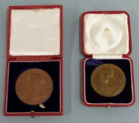 Victorian 1837-1897 bronze commemorative medal coin, together with a George V example, both cased