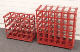 Two wine racks on wheels with combined space for fifty six bottles.