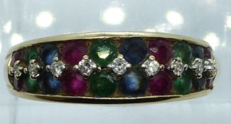 A 9ct gold ring set with round cut diamonds, emeralds, sapphires and rubies, 3.4g, size Q