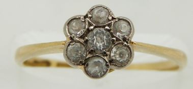 An 18ct gold ring set with white sapphires in a cluster, 2.1g, size size L