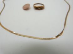 A 9ct gold ring set with paste, 9ct gold ribbon necklace and section of cufflink, 4.6g