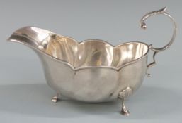 George V hallmarked silver sauce boat of lobed design, Chester 1910 maker's mark rubbed, length 18.