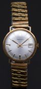 Garrard 9ct gold gentleman's wristwatch with date aperture, gold hands and baton markers, silver