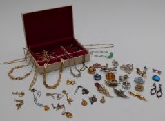 A collection of vintage brooches, Trifari necklace, rolled gold pendants etc